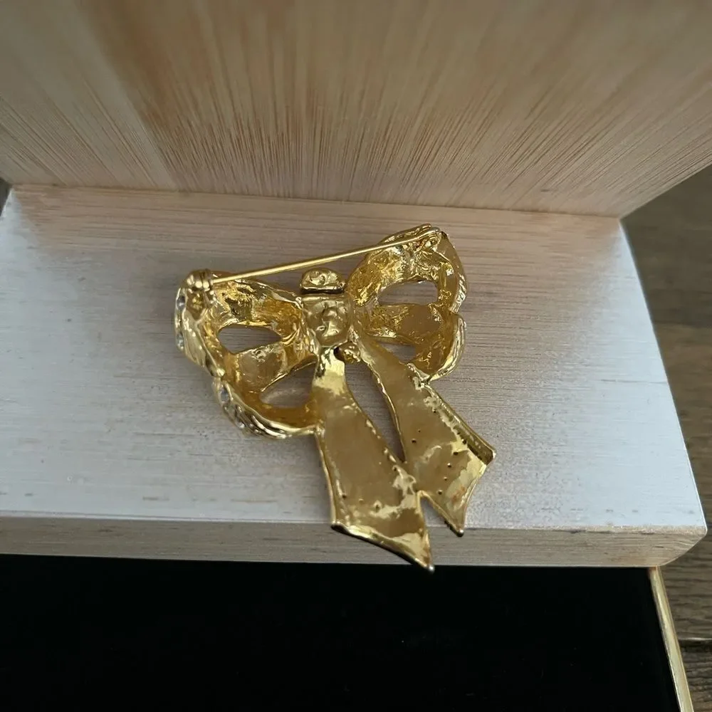 Gold tone vintage cz bow statement brooch